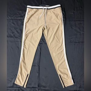 Goldish, black, with white side striped sweatpants.